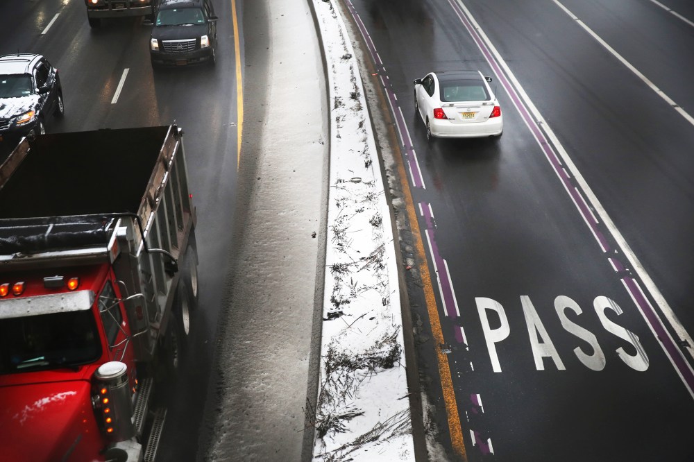 Vehicles slow at a toll booth at the George Washington Bridge on December 17, 2013.