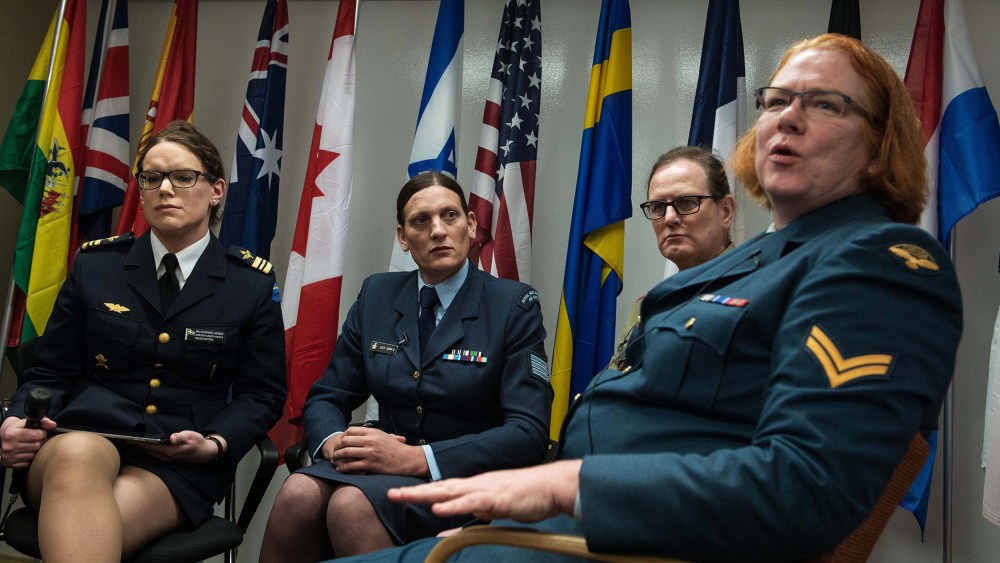 From left, transgender people Major Alexandra Larsson of the Swedish Armed Forces, Sergeant Lucy Jordan of the New Zealand Air Force and Major Donna Harding of the Royal Australian Army Nursing Corps listen to Corporal Natalie Murray of the Canadian Force