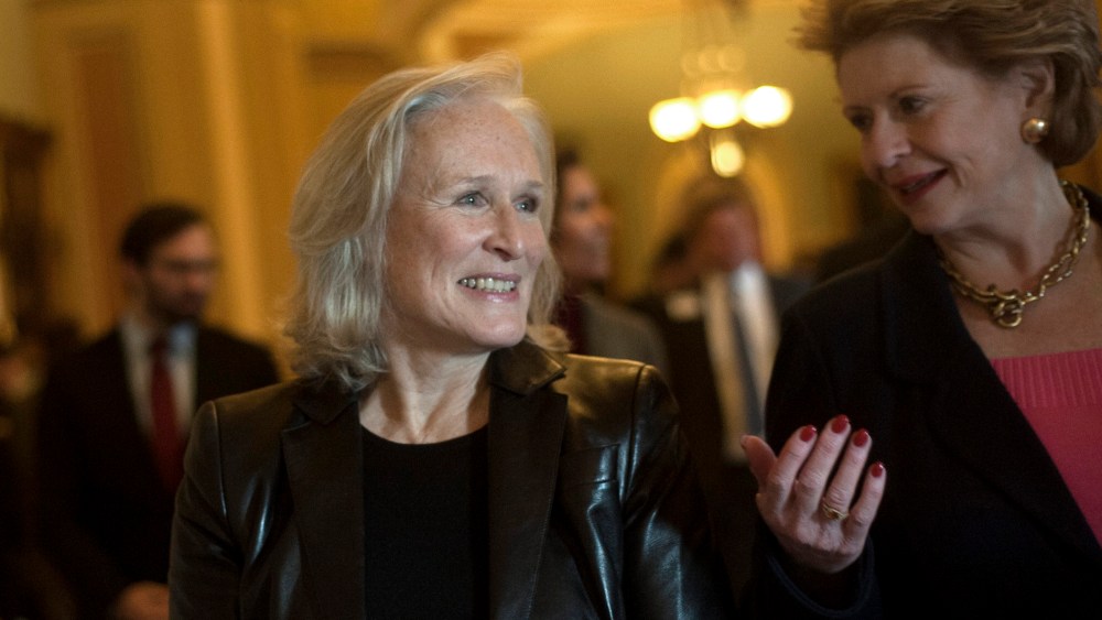 Glenn Close and Debbie Stabenow attend a press conference advocating for the passing of the Excellence In Mental Health Act on Dec. 18, 2013 in Washington D.C.