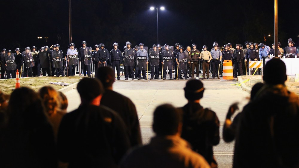 Police face off with demonstrators outside the police station as protests continue in the wake of 18-year-old Michael Brown's death on Oct. 22, 2014 in Ferguson, Mo.