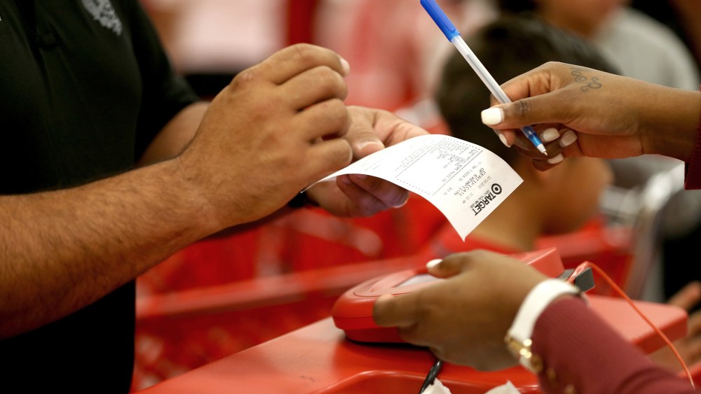 A customer prepares to sign a credit card slip at a Target store on Dec. 19, 2013 in Miami, Fla.