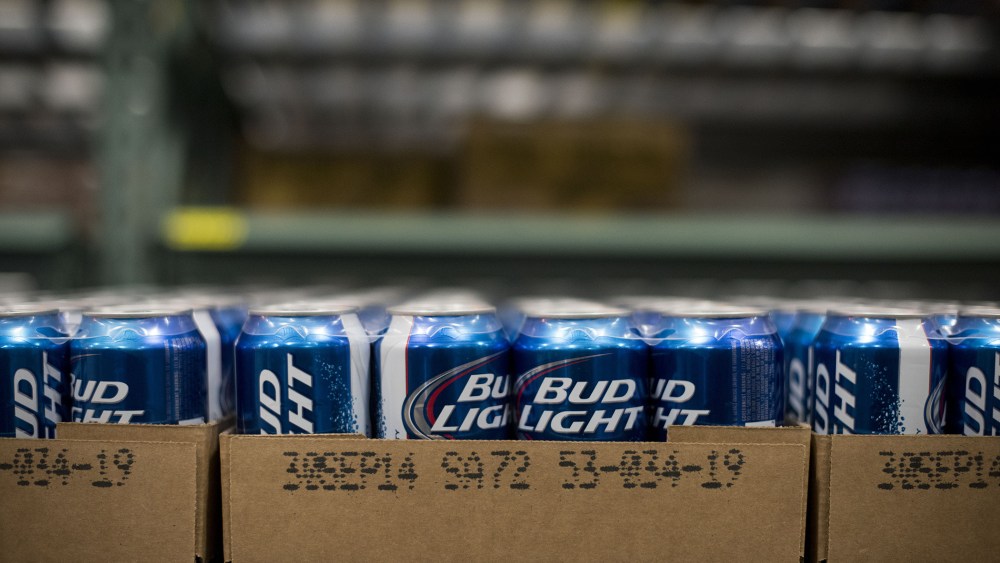 Cans of Anheuser-Busch Bud Light brand beer sits in a warehouse at Brewers Distributing Co. in Peoria, Illinois, U.S., on Oct. 30, 2014. (Photo by Daniel Acker/Bloomberg/Getty)