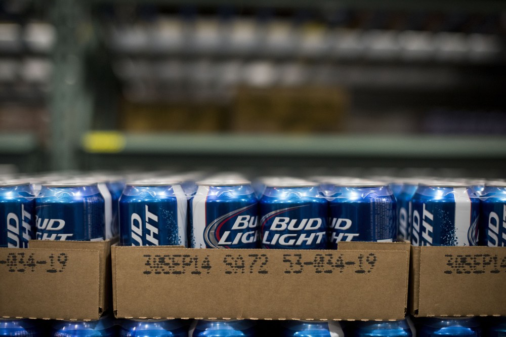 Cans of Anheuser-Busch Bud Light brand beer sits in a warehouse at Brewers Distributing Co. in Peoria, Illinois, U.S., on Oct. 30, 2014. (Photo by Daniel Acker/Bloomberg/Getty)