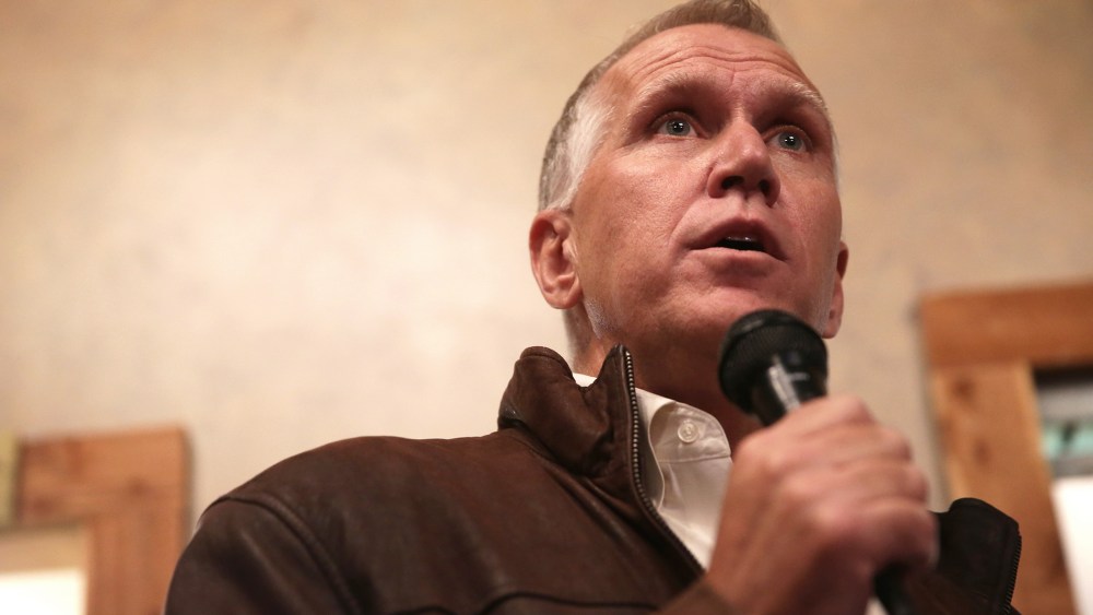 Then, Republican U.S. Senate candidate Thom Tillis speaks to voters during a Davie County GOP rally Nov. 2, 2014 in Mocksville, N.C. (Photo by Alex Wong/Getty)