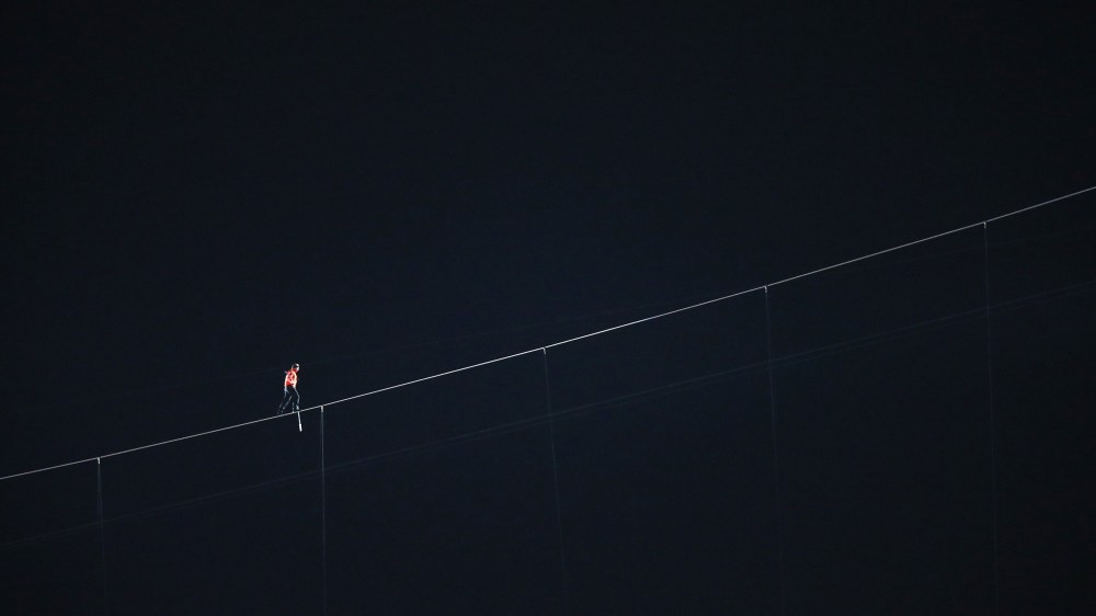 Tightrope walker Nik Wallenda walks on a 3/4 inch diameter wire on November 2, 2014.