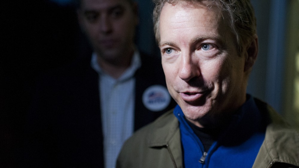 Sen. Rand Paul, R-Ky., speaks to the media after a rally with Senate Minority Leader Mitch McConnell, R-Ky., at the airport in Bowling Green, Ky., Nov. 3, 2014.