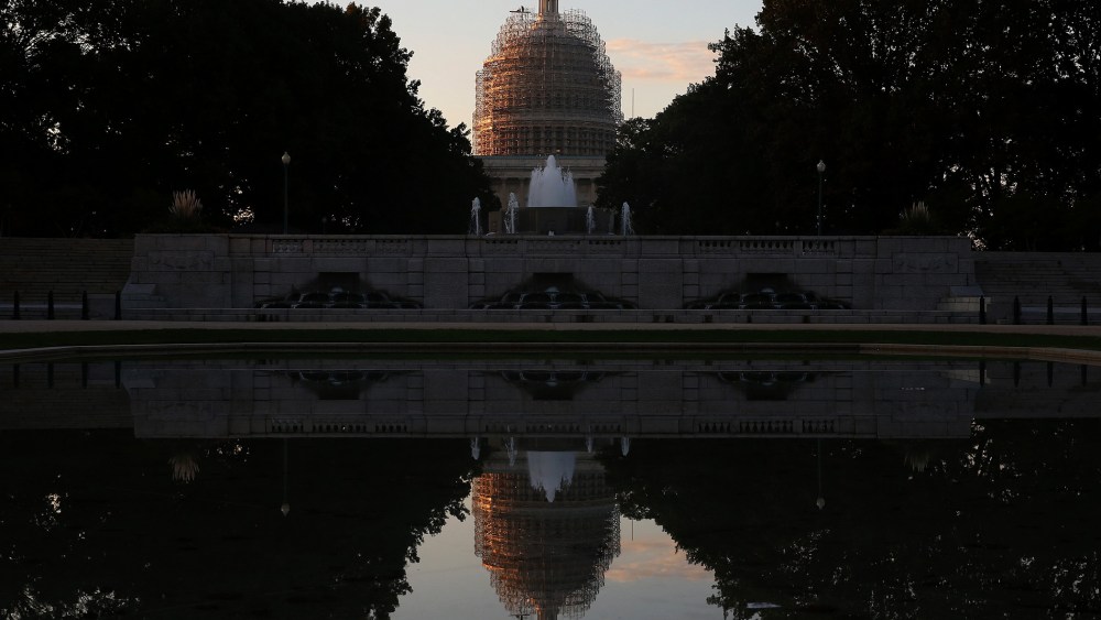 The U.S. Capitol is reflected in the Senate Park Reflecting pool, on Nov. 4, 2014 in Washington, DC. (Photo by Mark Wilson/Getty)