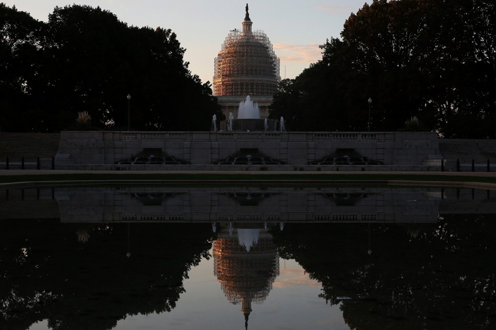 The U.S. Capitol is reflected in the Senate Park Reflecting pool, on Nov. 4, 2014 in Washington, DC. (Photo by Mark Wilson/Getty)