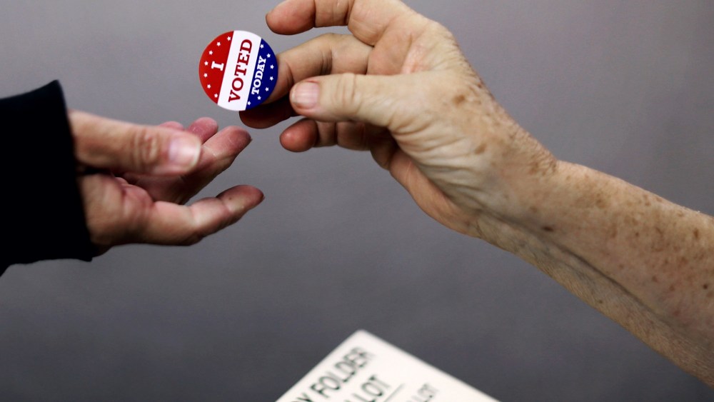 Voters get an 'I VOTED TODAY' sticker after casting their ballots on election day at the Red Oak Fire Department on Nov. 4, 2014 in Red Oak, Iowa.
