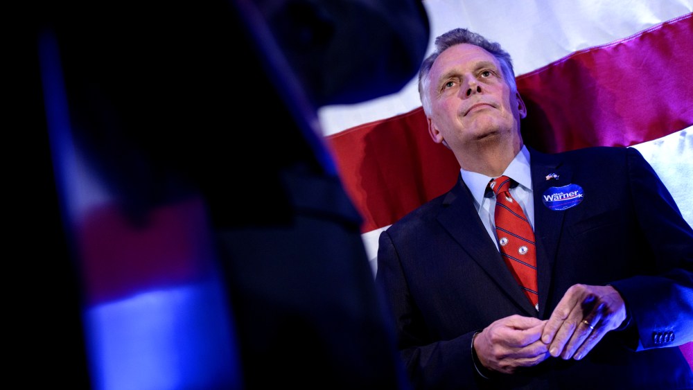 Virginia Governor Terry McAuliffe listens as midterm election results are announced during an election night rally Nov. 4, 2014 in Arlington, Virginia. (Photo by Brendan Smialowski /AFP/Getty)