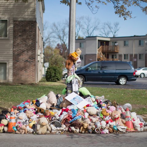Greg Bajema views the memorial of stuffed animals, flowers, tee-shirts and ball caps that remains on Nov. 5, 2014 in Ferguson, Mo. (Scott Olson/Getty)