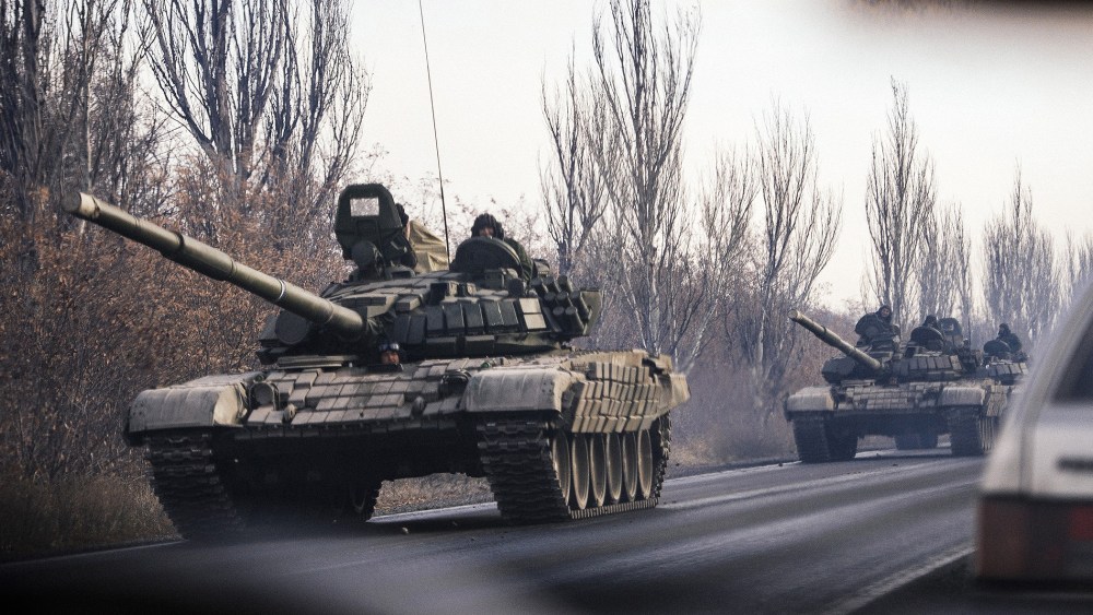 A column of tanks drive from a rebel-territory to Donetsk near the town of Shakhtarsk, eastern Ukraine on Nov. 10, 2014. (Photo by Dimitar Dilkoff/AFP/Getty)