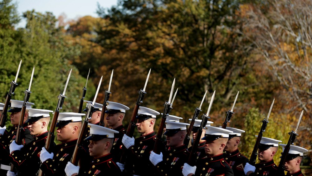 Honor guards for all branches of the U.S. military arrive for a wreath laying ceremony at The Tomb of the Unknowns on Nov. 11, 2014 in Arlington, Va.
