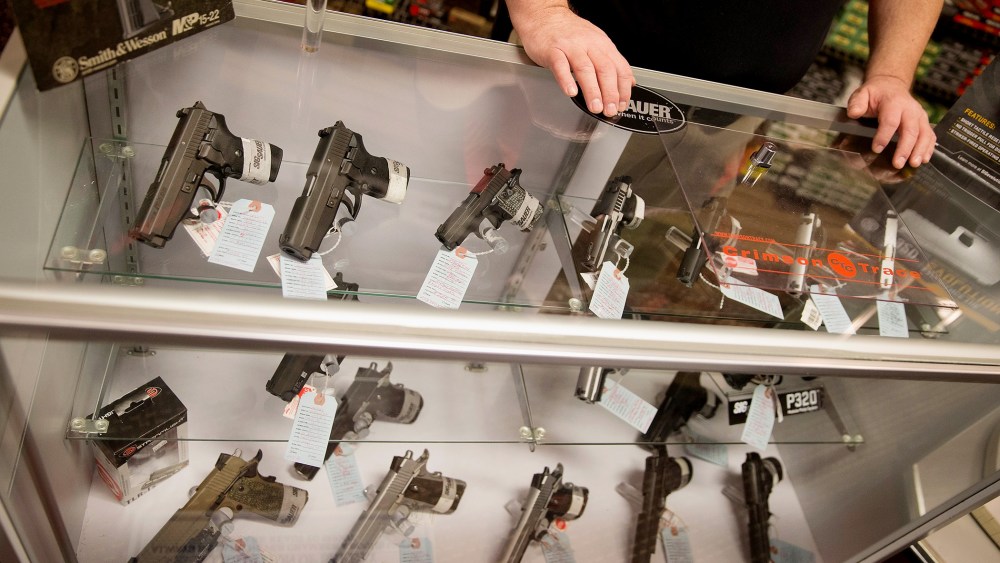 Customers shop for a handgun at Metro Shooting Supplies on Nov. 12, 2014 in Bridgeton, Mo. (Photo by Scott Olson/Getty)