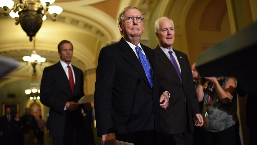 Then-Senate Minority Leader Mitch McConnell (C) (R-KY) arrives to answer questions following the weekly Republican policy luncheon at the U.S. Capitol on Nov. 13, 2014 in Washington, D.C. (Photo by Win McNamee/Getty)