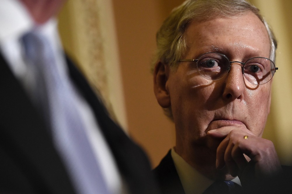 Senate Minority Leader Mitch McConnell (R-KY) answers questions following the weekly Republican policy luncheon at the U.S. Capitol on Nov. 13, 2014 in Washington, DC.