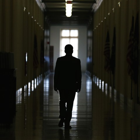 A man is silhouetted as he walks down a hallway in the Cannon House Office Building on Capitol Hill on Nov. 14, 2014 in Washington, D.C. (Photo by Mark Wilson/Getty)