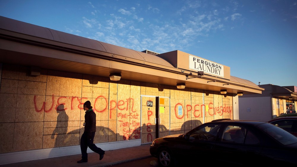 Plywood covers the glass front of a strip mall along West Florissant Street on Nov. 14, 2014 in Ferguson, Mo.