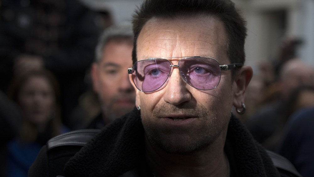 U2 frontman Bono arrives at a west London studio to record the new Band Aid 30 on Nov. 15, 2014. (ANDREW COWIE/AFP/Getty)