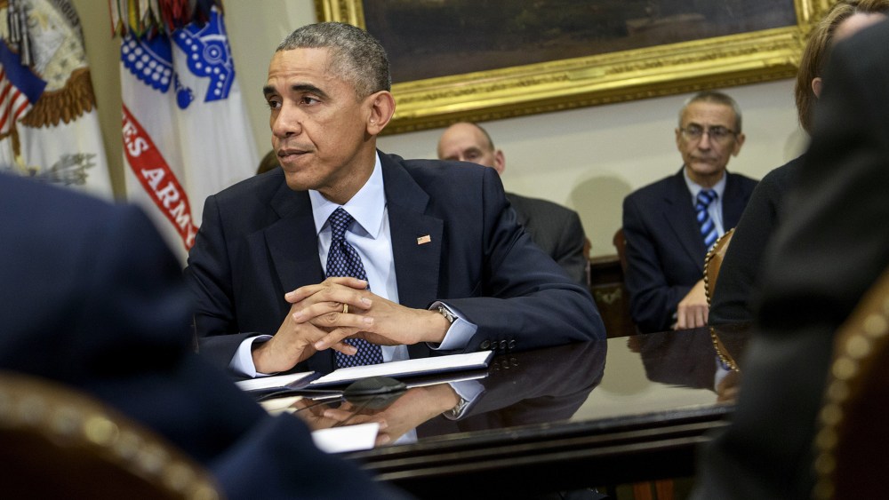 President Barack Obama waits before a meeting at the White House on Nov. 18, 2014 in Washington, D.C. (Photo by Brendan Smialowski/AFP/Getty)