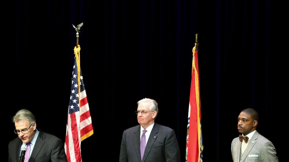 Missouri Governor Jay Nixon (C) stands with businessman Richard McClure (L) and minister Starsky Wilson after he announced them as the co-chairs of a 16-member Ferguson Commission on Nov. 18, 2014 in St. Louis, Mo.