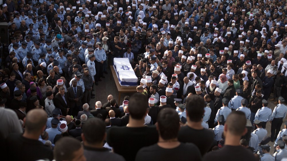 Druze men and relatives attend the funeral of Druze Israeli police officer Zidan Sif on Nov. 19, 2014 in the Druze village of Yanuh-Jat, Israel. (Lior Mizrahi/Getty)