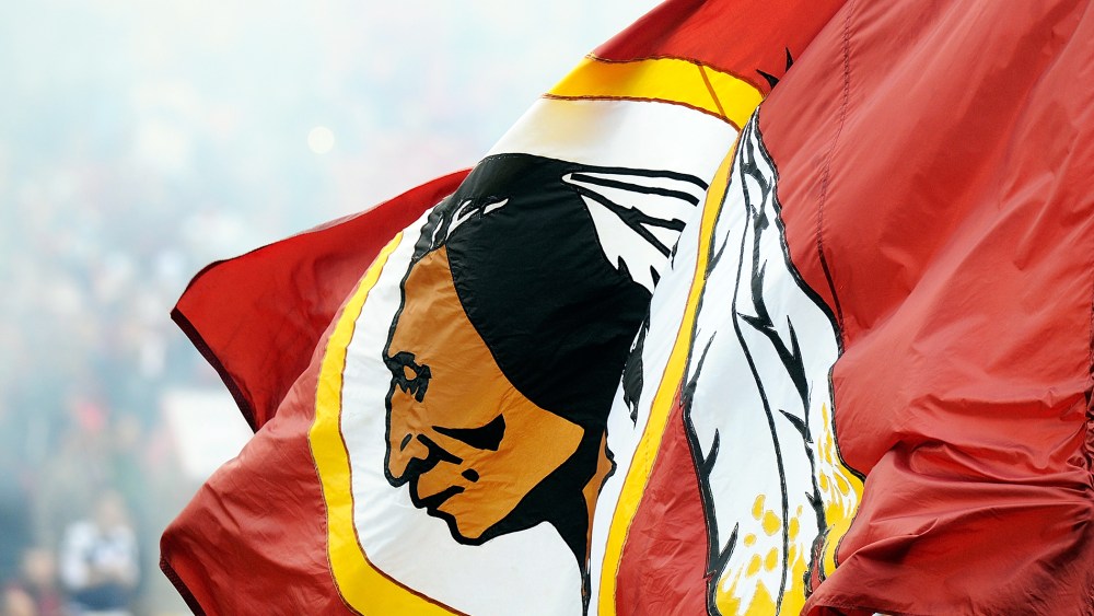 A Redskins flag is displayed before the game between the Dallas Cowboys and the Washington Redskins, Dec. 22, 2013.