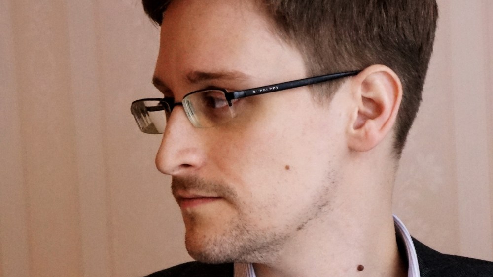 Edward Snowden poses for a photo during an interview in Moscow, Dec. 2013.