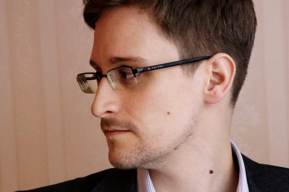 Edward Snowden poses for a photo during an interview in Moscow, Dec. 2013.