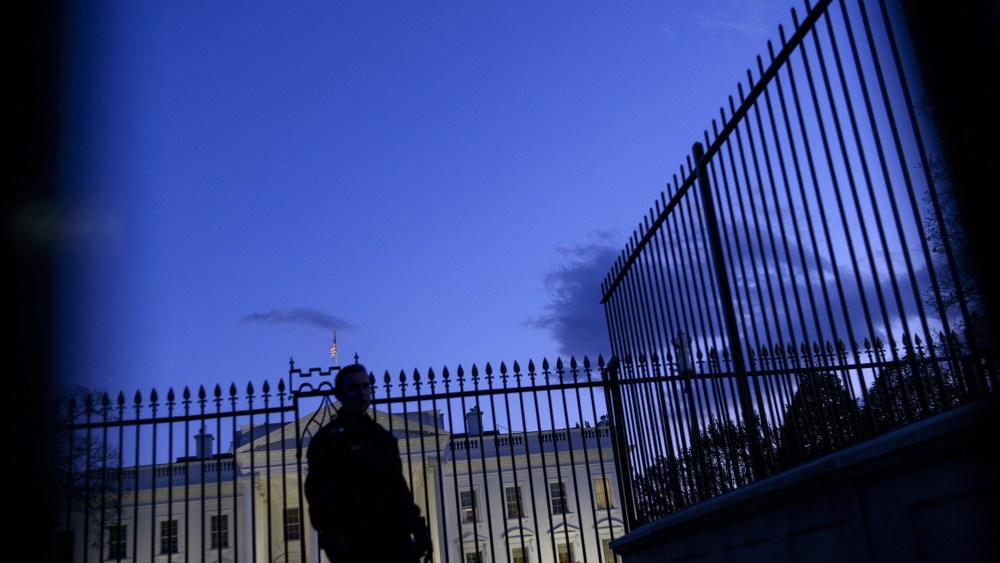 A member of the Secret Service's uniformed division stands by a fence in front of the White House on Nov. 20, 2014 in Washington, D.C. (Photo by Brendan Smialowski/AFP/Getty)