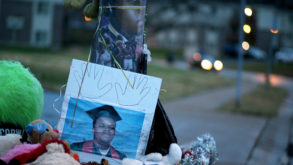 A photo of 18-year-old Michael Brown sits on a memorial on Nov. 22, 2014 in Ferguson, Mo. (Photo by Justin Sullivan/Getty)