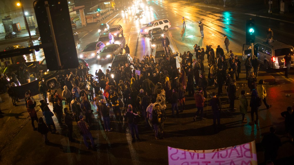 Demonstrators block traffic at an intersection as they march through the streets of the Shaw neighborhood, Nov. 23, 2014, in St. Louis, Mo. (Photo by Eric Thayer/The Washington Post/Getty)