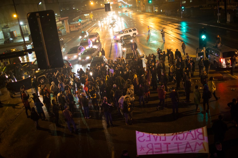 Demonstrators block traffic at an intersection as they march through the streets of the Shaw neighborhood, Nov. 23, 2014, in St. Louis, Mo. (Photo by Eric Thayer/The Washington Post/Getty)
