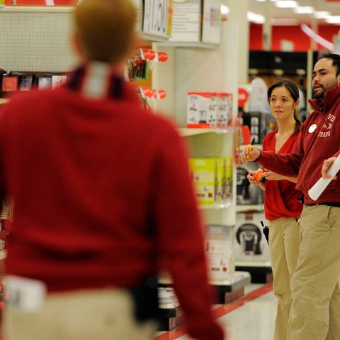 Melissa Mayhue (L) and Nick Vigil check out the use two what needs to be stocked on Nov. 24, 2014 at the Glendale Target.
