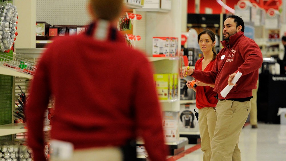 Melissa Mayhue (L) and Nick Vigil check out the use two what needs to be stocked on Nov. 24, 2014 at the Glendale Target.
