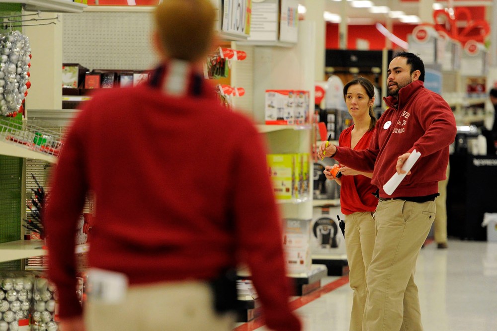 Melissa Mayhue (L) and Nick Vigil check out the use two what needs to be stocked on Nov. 24, 2014 at the Glendale Target.