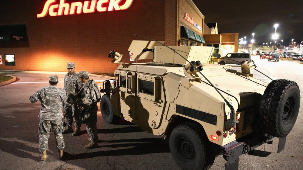 National Guard troops arrive ahead of the grand jury announcement in the Michael Brown shooting case on Nov. 24, 2014 in Ferguson, Mo. (Photo by Scott Olson/Getty)