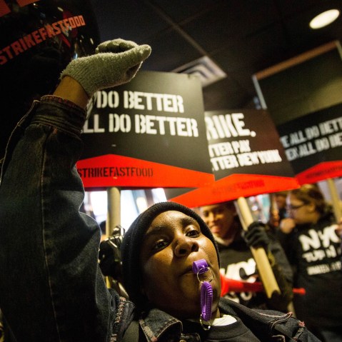 Protesters march through a McDonalds demanding a raise on the minimum wage to $15 per hour on Dec. 4, 2014 in New York.
