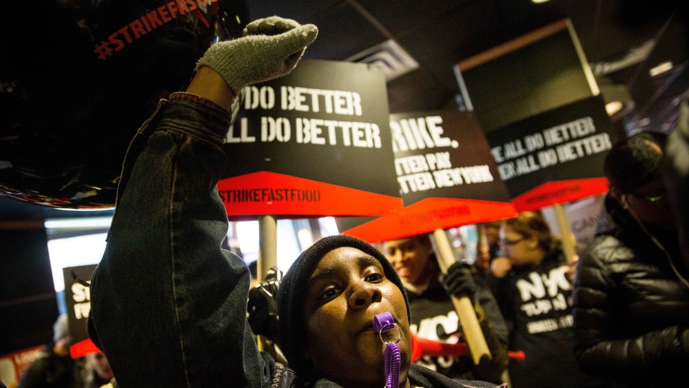 Protesters march through a McDonalds demanding a raise on the minimum wage to $15 per hour on Dec. 4, 2014 in New York.