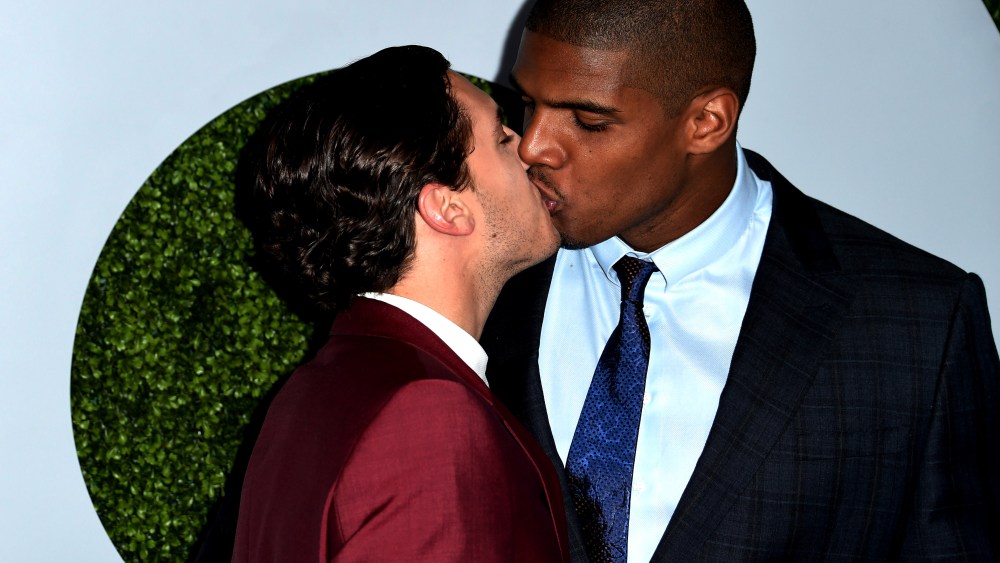 American football player Michael Sam (R) and Vito Cammisano kiss as they arrive for the GQ Men of the Year Party, at Chateau Marmont in West Hollywood, California, on Dec. 4, 2014. (Photo by Robyn Beck/AFP/Getty)