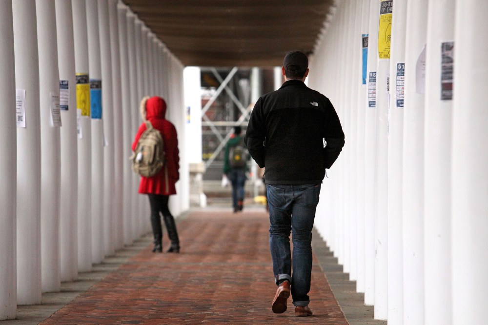 Students walk through an outdoor corridor on the on the University of Virginia campus on Dec. 6, 2014 in Charlottesville, Va. (Photo by Jay Paul/Getty)