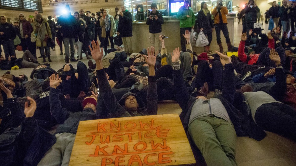 Demonstrators stage a Die-In in Grand Central Terminal protesting the Staten Island, N.Y. grand jury's decision not to indict a police officer involved in the chokehold death of Eric Garner in July on Dec. 6, 2014. (Andrew Burton/Getty)