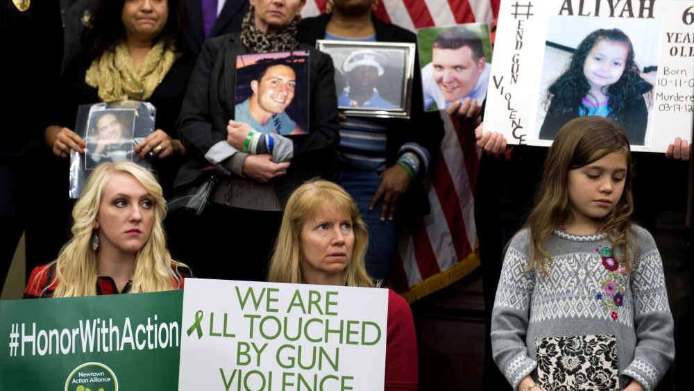 Gun violence advocates and relatives of victims during a press conference on the second anniversary of the shootings at Sandy Hook Elementary School in Newtown, Conn., in Washington, DC, Dec. 10, 2014. (Photo by Saul Loeb/AFP/Getty)