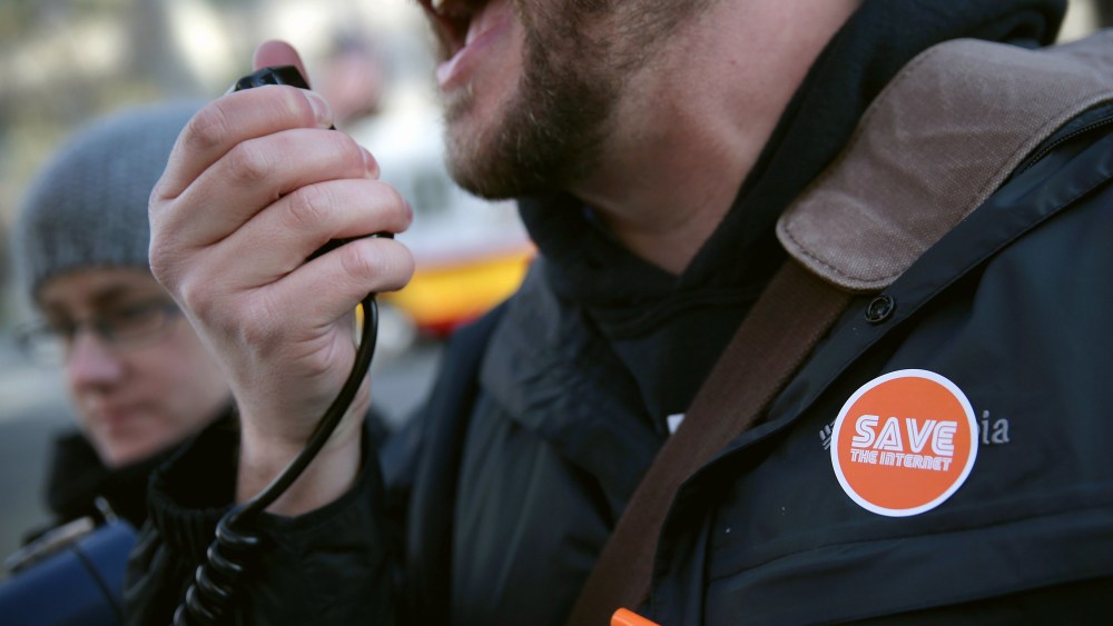 An activist speaks during a rally outside the headquarters of the Federal Communications Commission on Dec. 11, 2014 in Washington, DC. (Alex Wong/Getty)