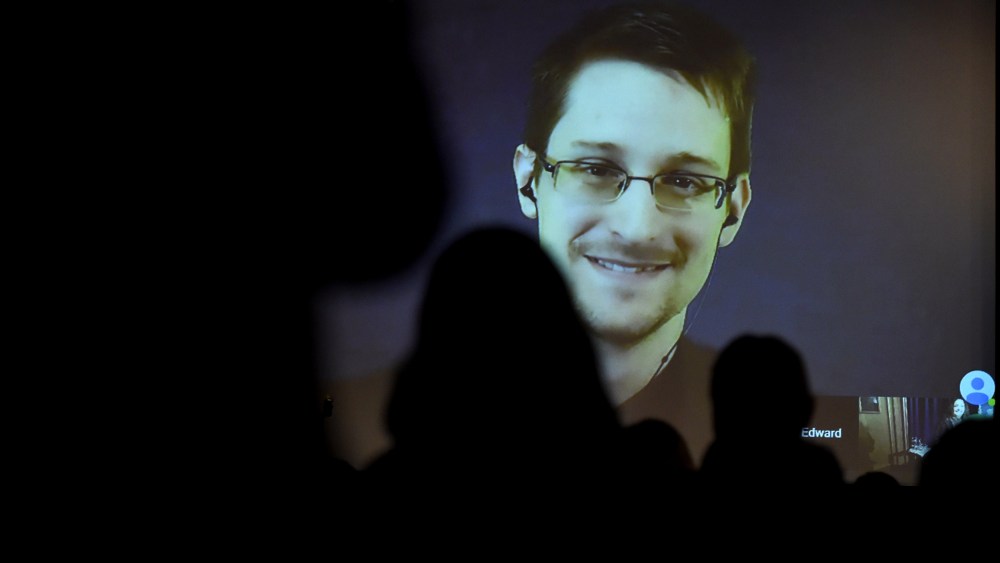 Edward Snowden greets the audience before he is honoured with the Carl von Ossietzky medal by International League for Human Rights to during a video conference call after he received the award in Berlin Dec. 14, 2014. (Photo by Tobias Schwarz/AFP/Getty)