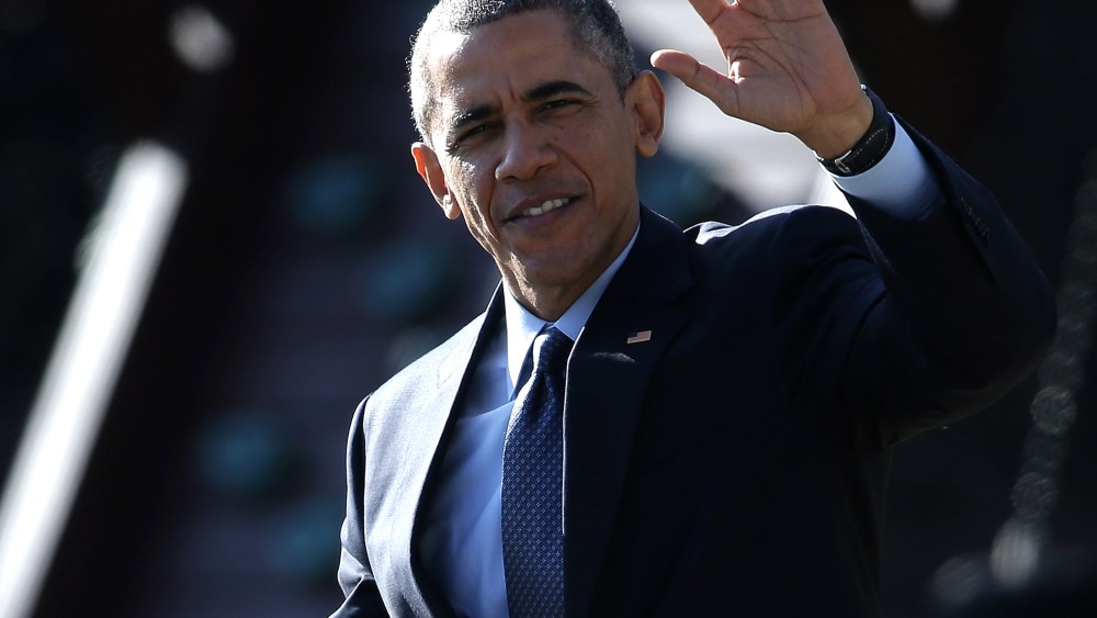 U.S. President Barack Obama waves as he departs the White House on Dec. 15, 2014 in Washington, DC.
