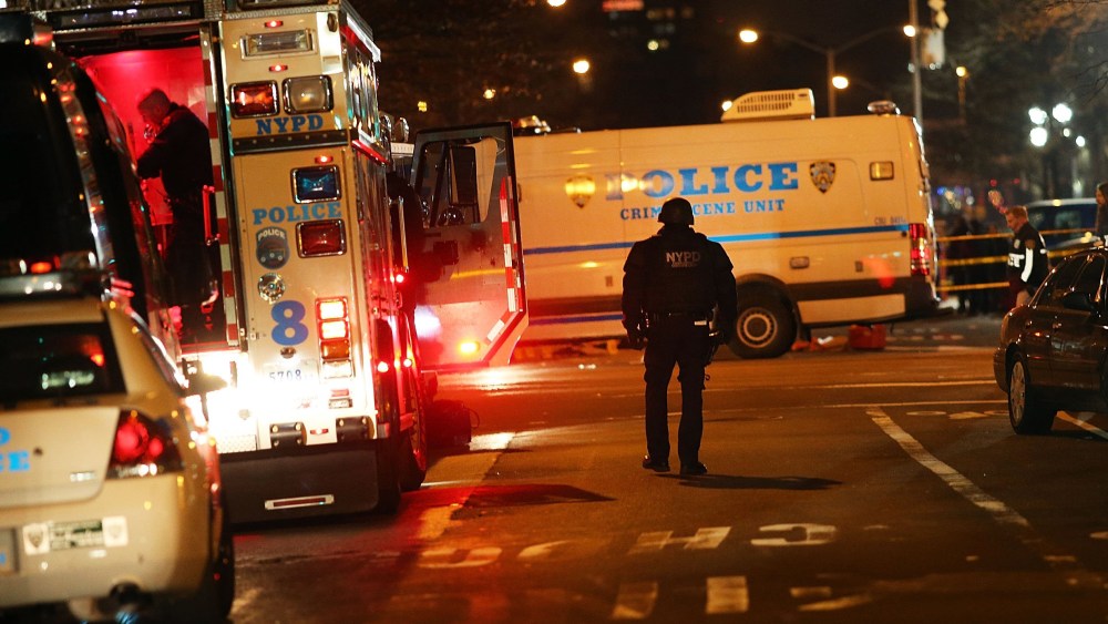 The scene at a shooting where two New York City police officers were killed execution style as they sat in their marked police car on a Brooklyn street corner on Dec. 20, 2014. (Spencer Platt/Getty)