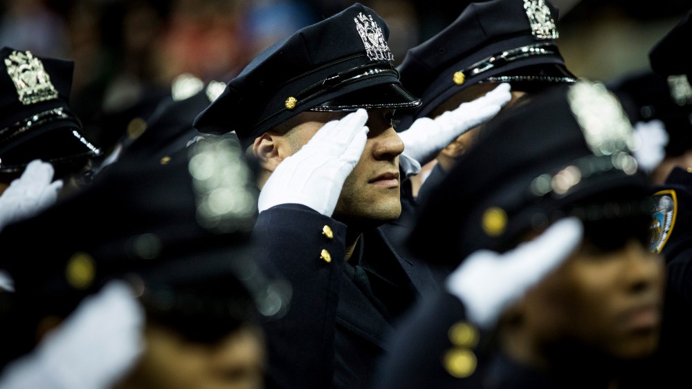 Police officers attend their New York Police Department graduation ceremony at Madison Square Garden on Dec. 29, 2014 in New York City.