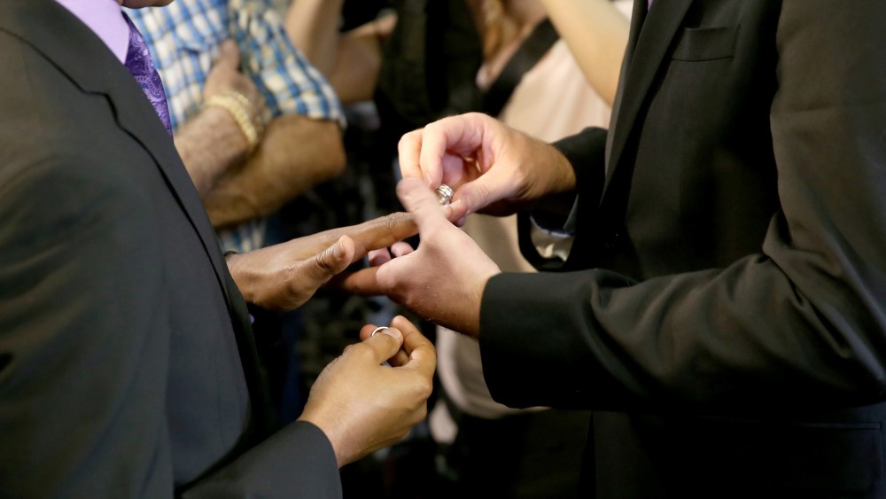 Newlyweds Jeff Delmay and Todd Delmay (L-R) exchange rings during a marriage ceremony in the Miami-Dade court room of Circuit Judge Sarah Zabel on Jan. 5, 2015 in Miami, Fla.