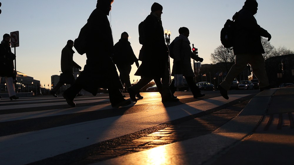 Commuters brave the frigid temperature as they cross the street on Capitol Hill, Jan. 7, 2014 in Washington, D.C.